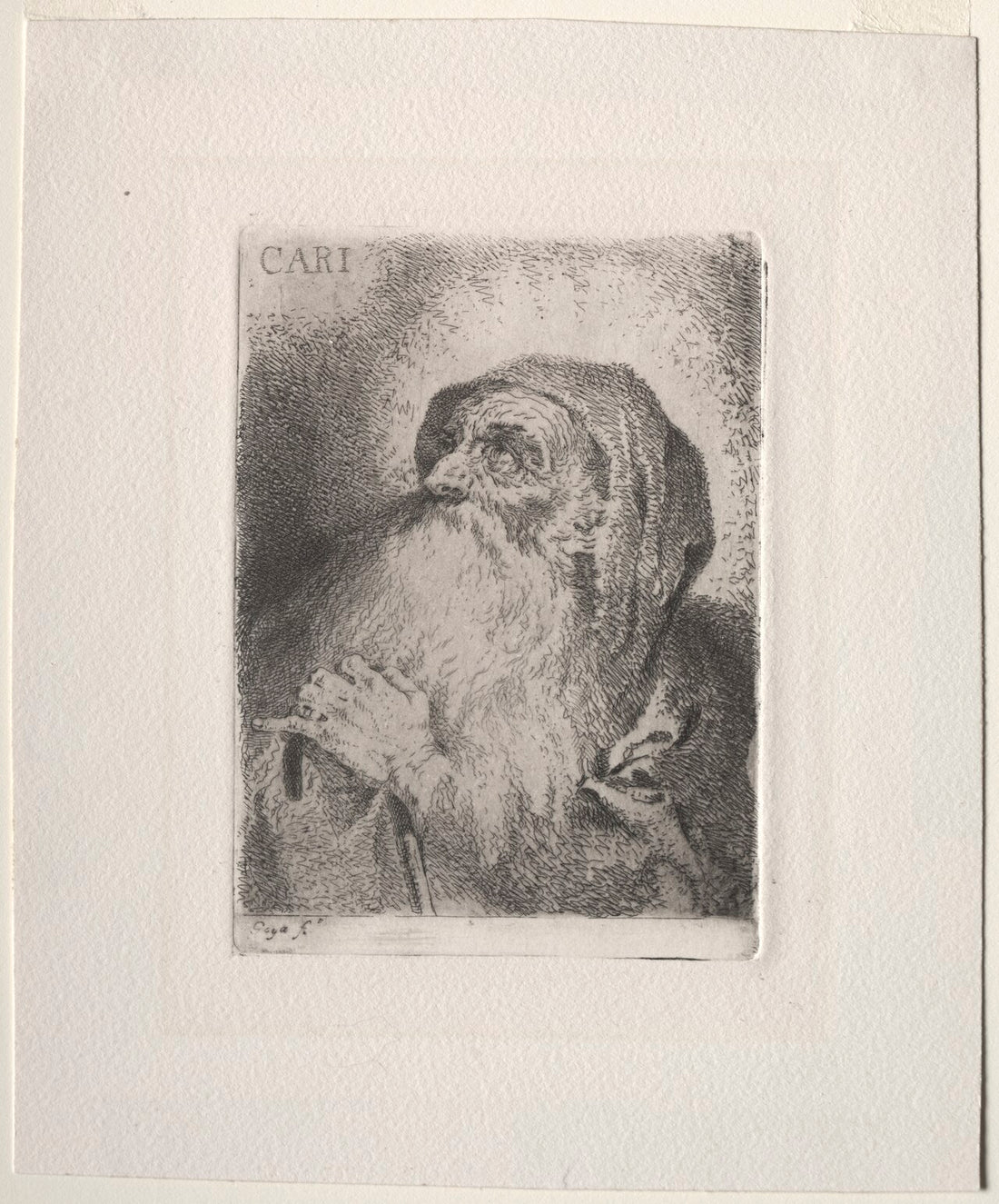 Pintura al óleo que representa a San Francisco de Paula como un fraile anciano con hábito oscuro y capucha, sosteniendo un bastón y mirando hacia un resplandor luminoso con la palabra Caritas.